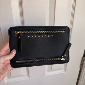 Sleek Black Passport Wallet with Gold Accents